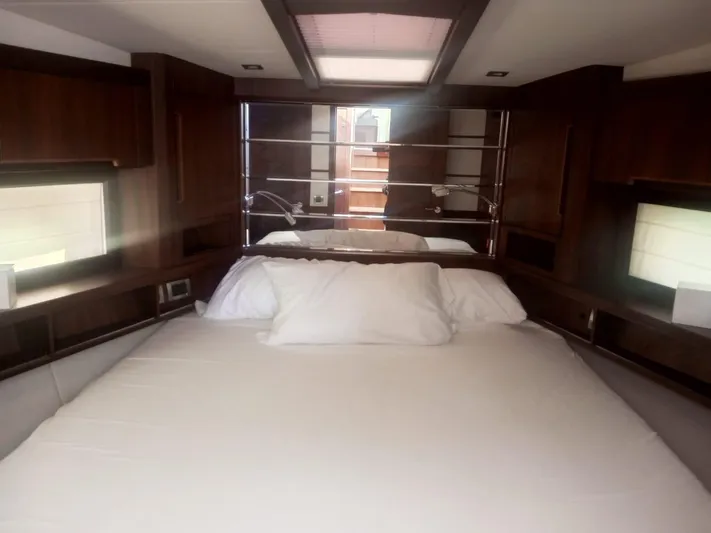 Sadeen Yacht Photos Pics Luxurious bedroom interior of 2016 Galeon 550 Fly yacht with elegant wood finishes.