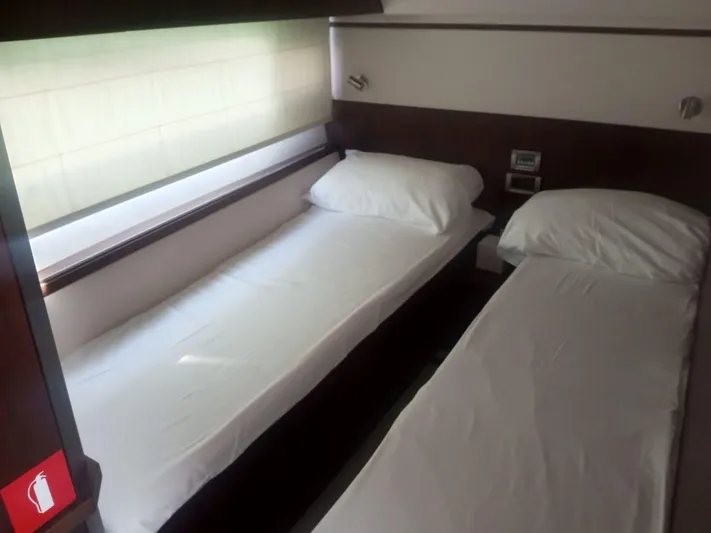 Sadeen Yacht Photos Pics Twin beds in a 2016 Galeon 550 Fly yacht cabin, featuring modern design and natural light.