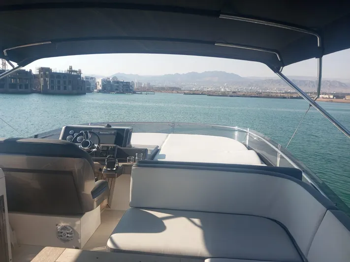 Sadeen Yacht Photos Pics Flybridge view of 2016 Galeon 550 Fly yacht on calm waters.