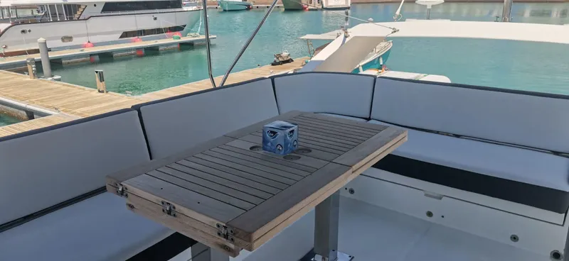 Sadeen Yacht Photos Pics Luxury seating area on 2016 Galeon 550 Fly yacht at marina.