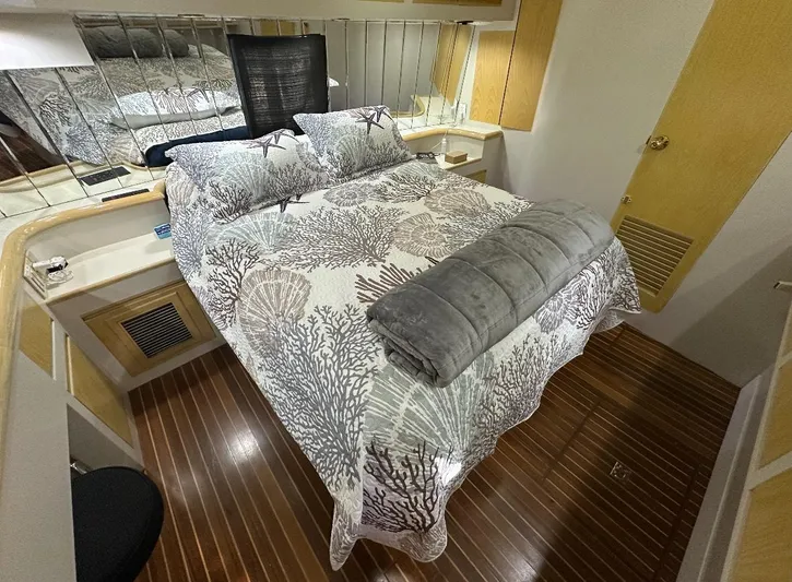  Yacht Photos Pics Luxurious bedroom interior of 1994 President 445 Sundeck yacht with elegant bedding.