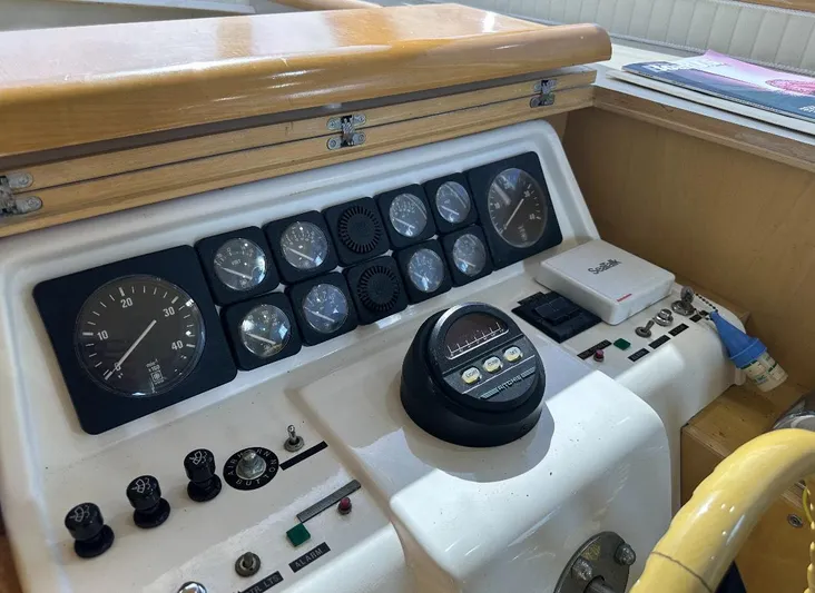  Yacht Photos Pics Control panel of a 1994 President 445 Sundeck yacht with gauges and navigation equipment.