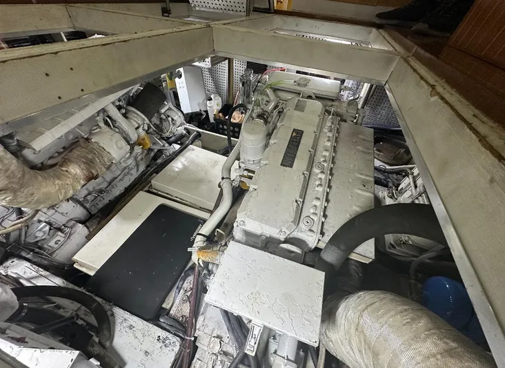  Yacht Photos Pics Engine room of 1994 President 445 Sundeck yacht, showcasing mechanical components and layout.