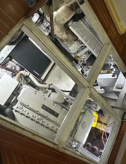  Yacht Photos Pics Engine room of 1994 President 445 Sundeck yacht, showcasing mechanical components and equipment.