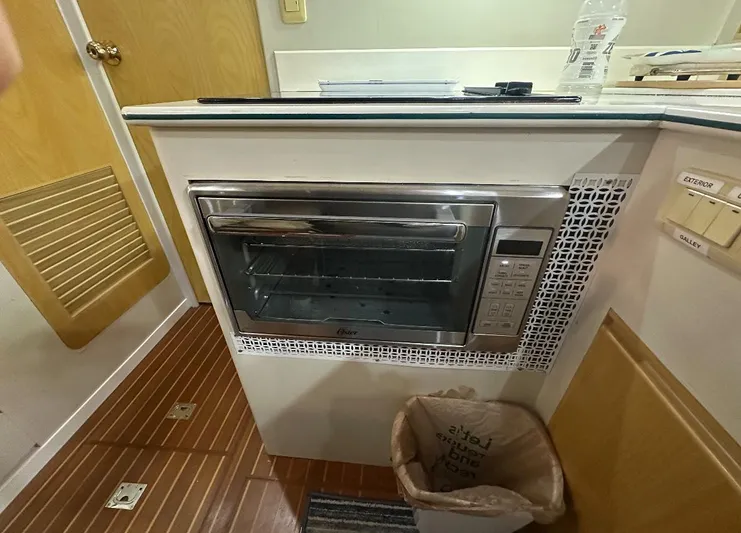  Yacht Photos Pics Kitchen area of 1994 President 445 Sundeck yacht with built-in microwave oven.