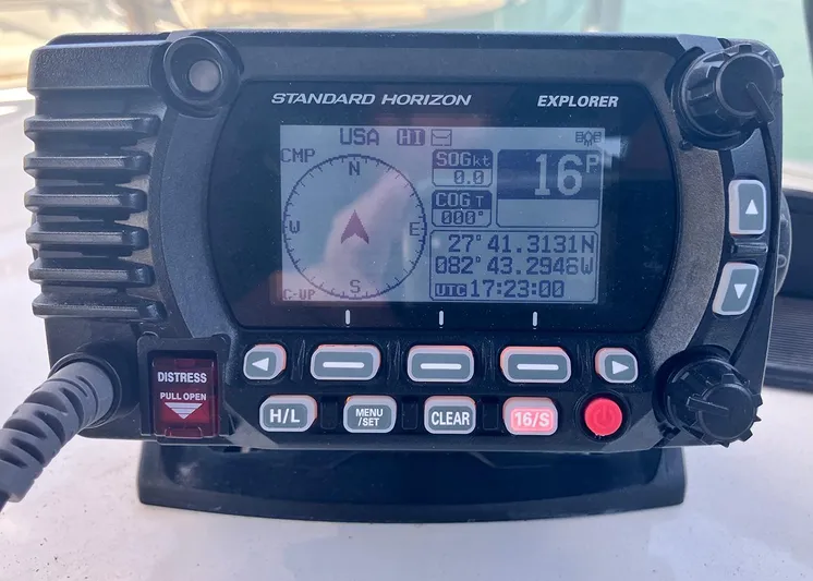 New Moon Yacht Photos Pics Standard Horizon Explorer marine radio on a 1996 Hatteras 42 CPMY, displaying coordinates and navigation data.