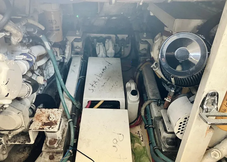 New Moon Yacht Photos Pics Engine room of 1996 Hatteras 42 CPMY yacht, showing mechanical components and wiring.
