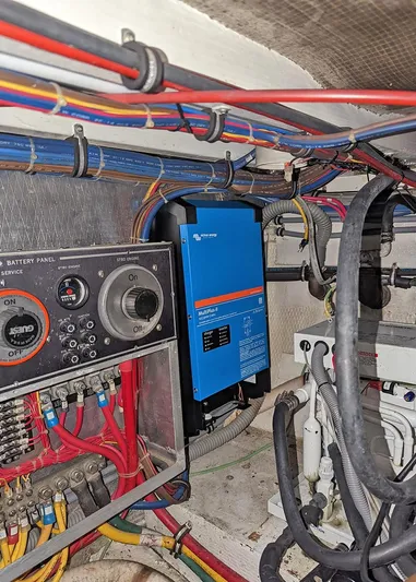 New Moon Yacht Photos Pics Electrical system of a 1996 Hatteras 42 CPMY yacht, featuring wiring and control panels.