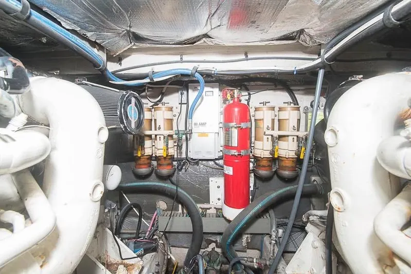  Yacht Photos Pics Engine room of a 1998 Sea Ray 500 Sundancer with fire extinguisher and fuel filters.