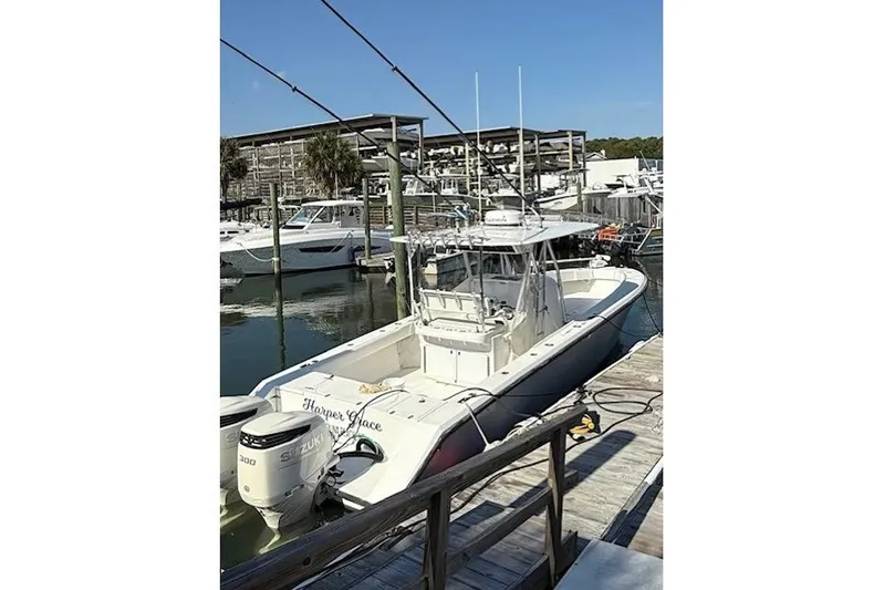  Yacht Photos Pics 1999 Venture 34 Open boat docked with dual Suzuki engines.