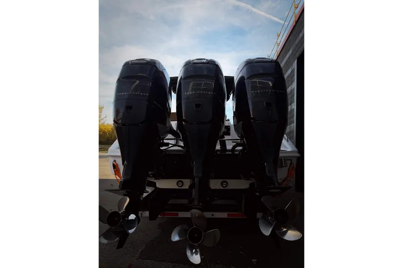  Yacht Photos Pics Triple outboard engines on a 2006 Donzi 35 ZF Cuddy boat, viewed from the rear.