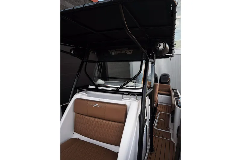  Yacht Photos Pics 2006 Donzi 35 ZF Cuddy interior with brown seating and sleek design.