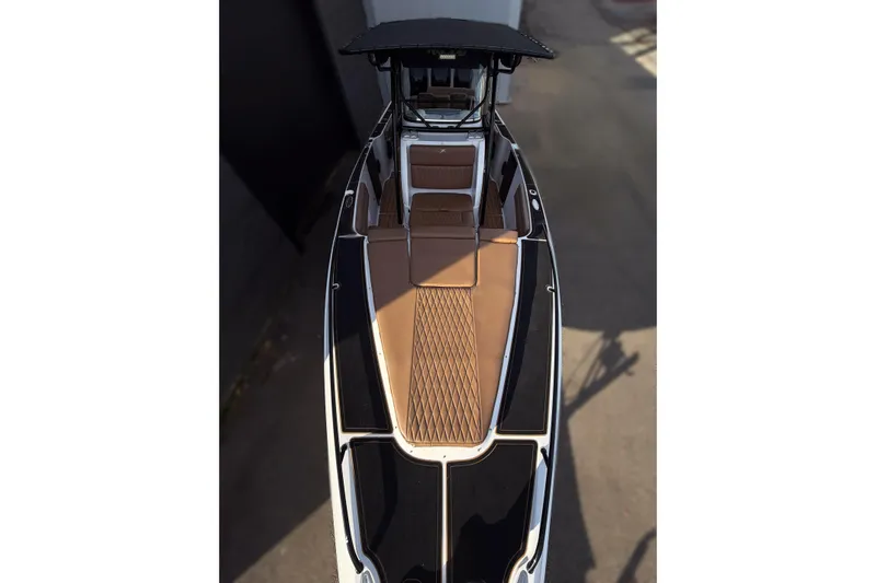  Yacht Photos Pics 2006 Donzi 35 ZF Cuddy boat with sleek black and brown design, top view.