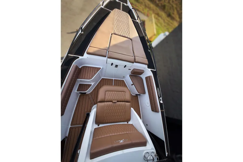  Yacht Photos Pics 2006 Donzi 35 ZF Cuddy boat interior with brown cushioned seating and sleek design.