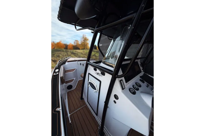  Yacht Photos Pics 2006 Donzi 35 ZF Cuddy boat interior with sleek design and modern controls.