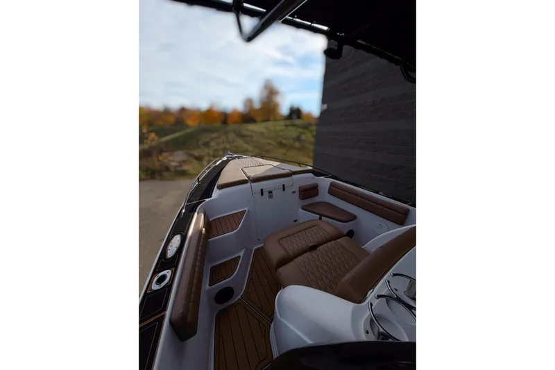  Yacht Photos Pics 2006 Donzi 35 ZF Cuddy boat interior with brown seating and sleek design.