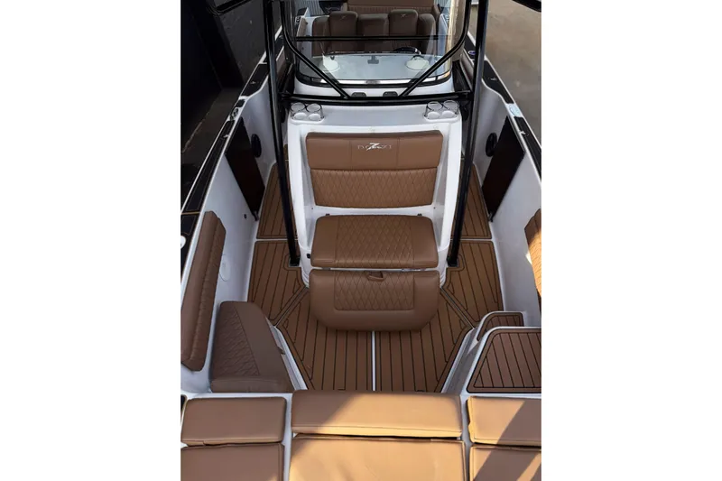  Yacht Photos Pics 2006 Donzi 35 ZF Cuddy boat interior with brown cushioned seating and sleek design.