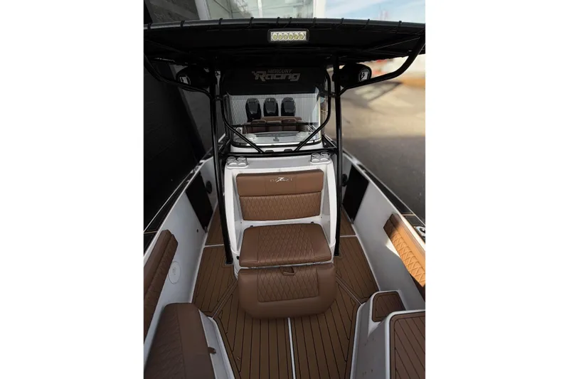  Yacht Photos Pics 2006 Donzi 35 ZF Cuddy interior with brown seating and sleek design.