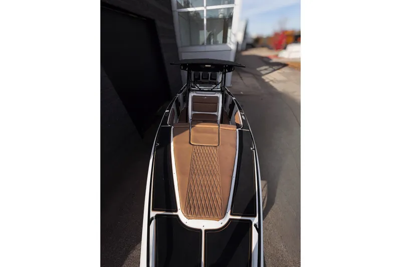  Yacht Photos Pics 2006 Donzi 35 ZF Cuddy boat with sleek design and brown deck.