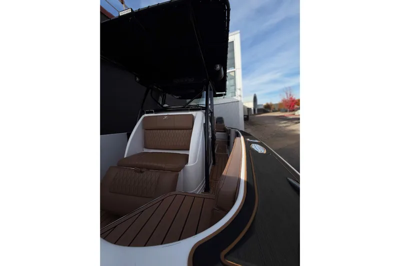  Yacht Photos Pics 2006 Donzi 35 ZF Cuddy boat interior with brown seating and sleek design.