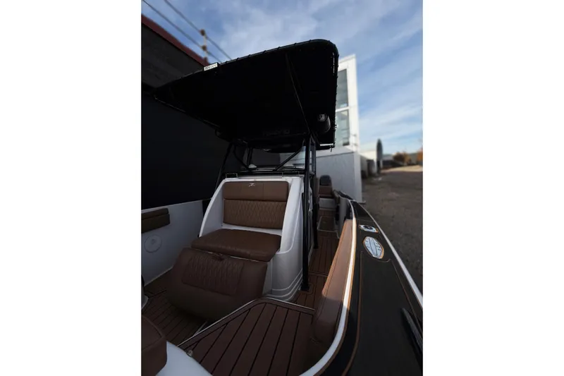  Yacht Photos Pics 2006 Donzi 35 ZF Cuddy boat interior with brown seating and sleek design.