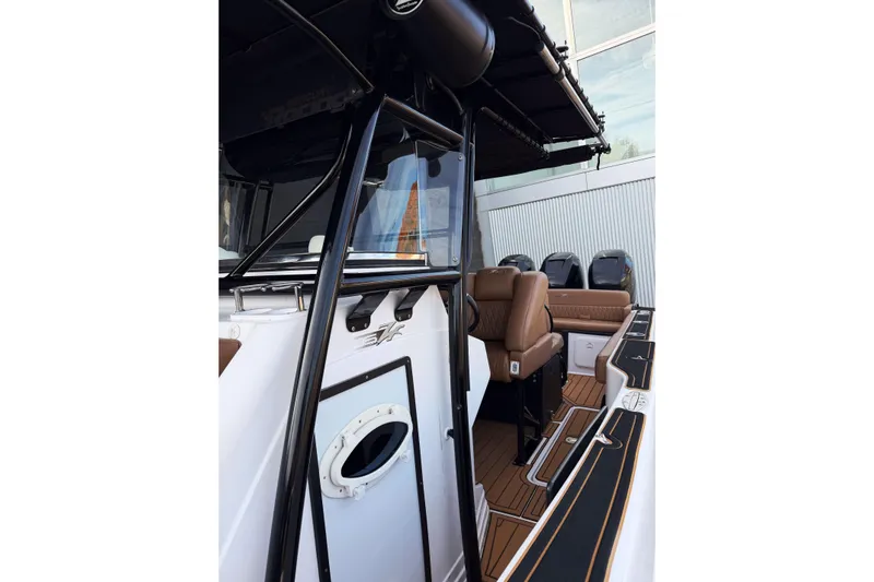  Yacht Photos Pics 2006 Donzi 35 ZF Cuddy boat interior with seating and controls.