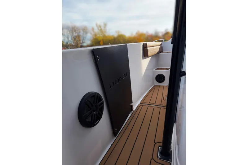  Yacht Photos Pics 2006 Donzi 35 ZF Cuddy boat interior with teak flooring and speaker system.