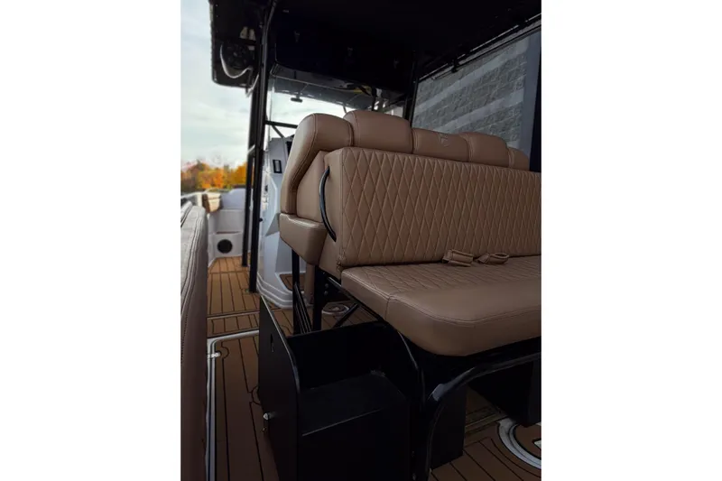  Yacht Photos Pics 2006 Donzi 35 ZF Cuddy boat interior with tan leather seating and sleek design.