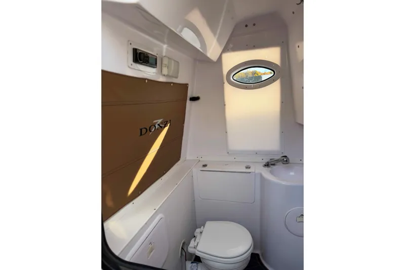  Yacht Photos Pics Interior of 2006 Donzi 35 ZF Cuddy boat, featuring compact bathroom amenities.