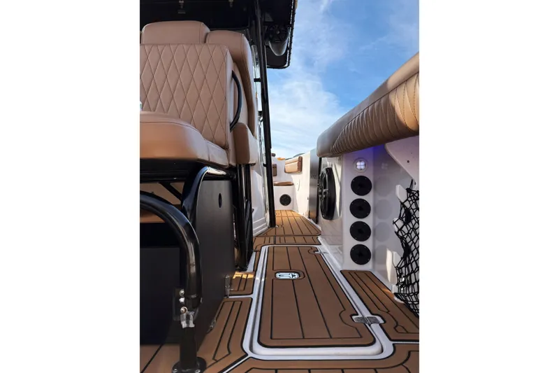  Yacht Photos Pics 2006 Donzi 35 ZF Cuddy interior with tan seating and sleek deck design.