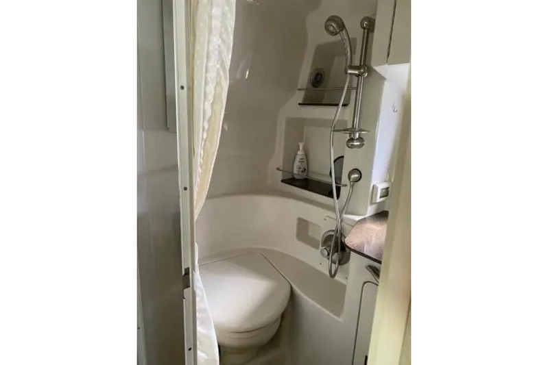  Yacht Photos Pics Compact bathroom in 2012 Sea Ray 350 Sundancer yacht with shower and toilet.