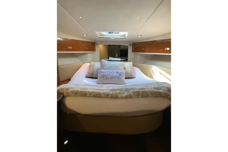  Yacht Photos Pics Luxurious cabin interior of 2012 Sea Ray 350 Sundancer yacht with cozy bedding.