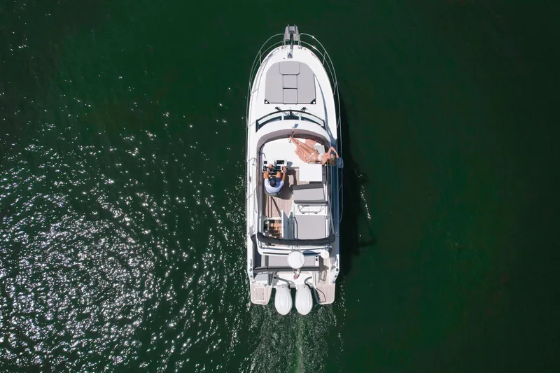  Yacht Photos Pics Aerial view of 2024 Jeanneau NC1095 Fly yacht cruising on water.