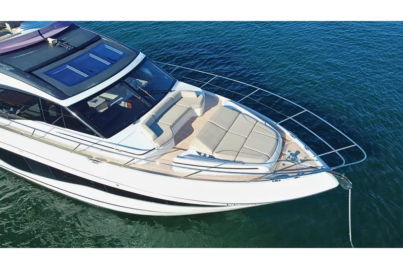 B III Yacht Photos Pics Luxurious 2021 Princess S62 yacht with sleek design, anchored on calm blue waters.