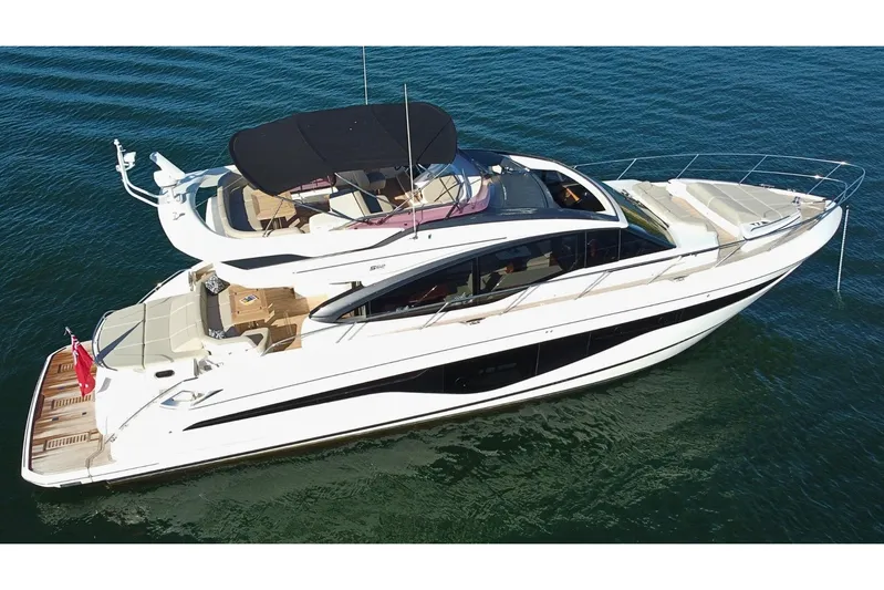 B III Yacht Photos Pics Luxury 2021 Princess S62 yacht cruising on calm waters, featuring sleek design and spacious deck.