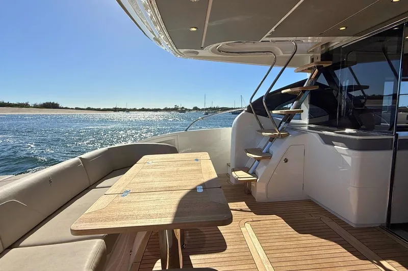 B III Yacht Photos Pics Luxurious 2021 Princess S62 yacht deck with seating and ocean view.