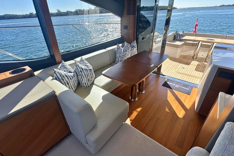B III Yacht Photos Pics Luxurious 2021 Princess S62 yacht interior with elegant seating and scenic ocean view.