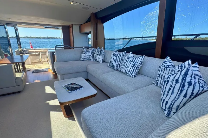 B III Yacht Photos Pics Luxurious interior of 2021 Princess S62 yacht with elegant seating and scenic ocean view.