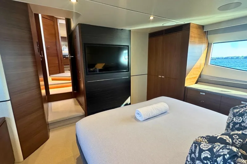B III Yacht Photos Pics Luxurious 2021 Princess S62 yacht bedroom with modern decor and ocean view.
