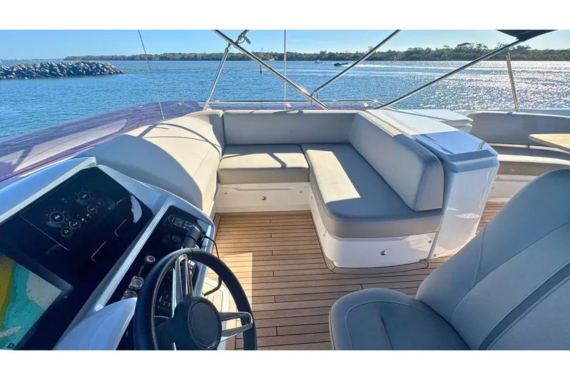 B III Yacht Photos Pics Luxurious 2021 Princess S62 yacht interior with elegant seating and modern controls.