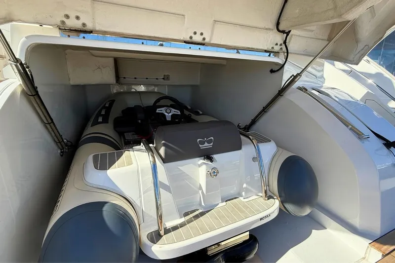 B III Yacht Photos Pics 2021 Princess S62 yacht with a stored inflatable tender in the garage.