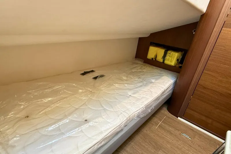B III Yacht Photos Pics Cozy cabin bed in 2021 Princess S62 yacht with wooden accents.
