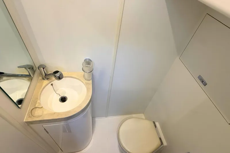 B III Yacht Photos Pics Compact bathroom in 2021 Princess S62 yacht with sink and toilet.