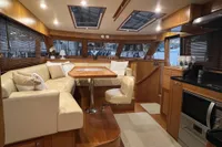Luxurious interior of 2007 Trader 42 HT yacht with elegant seating and modern kitchen amenities.