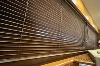 Wooden blinds inside a 2007 Trader 42 HT yacht, showcasing elegant interior design.