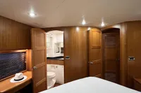 Luxurious cabin interior of 2007 Trader 42 HT yacht with wooden finish and modern amenities.
