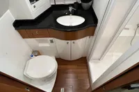 Luxurious bathroom in 2007 Trader 42 HT yacht with modern fixtures and wooden flooring.