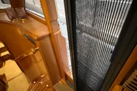 Interior view of 2007 Trader 42 HT yacht, featuring wooden stairs and modern design elements.