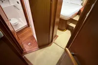Interior of 2007 Trader 42 HT yacht showing bedroom and bathroom.