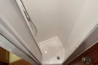 Shower area inside 2007 Trader 42 HT yacht, featuring a compact, modern design.